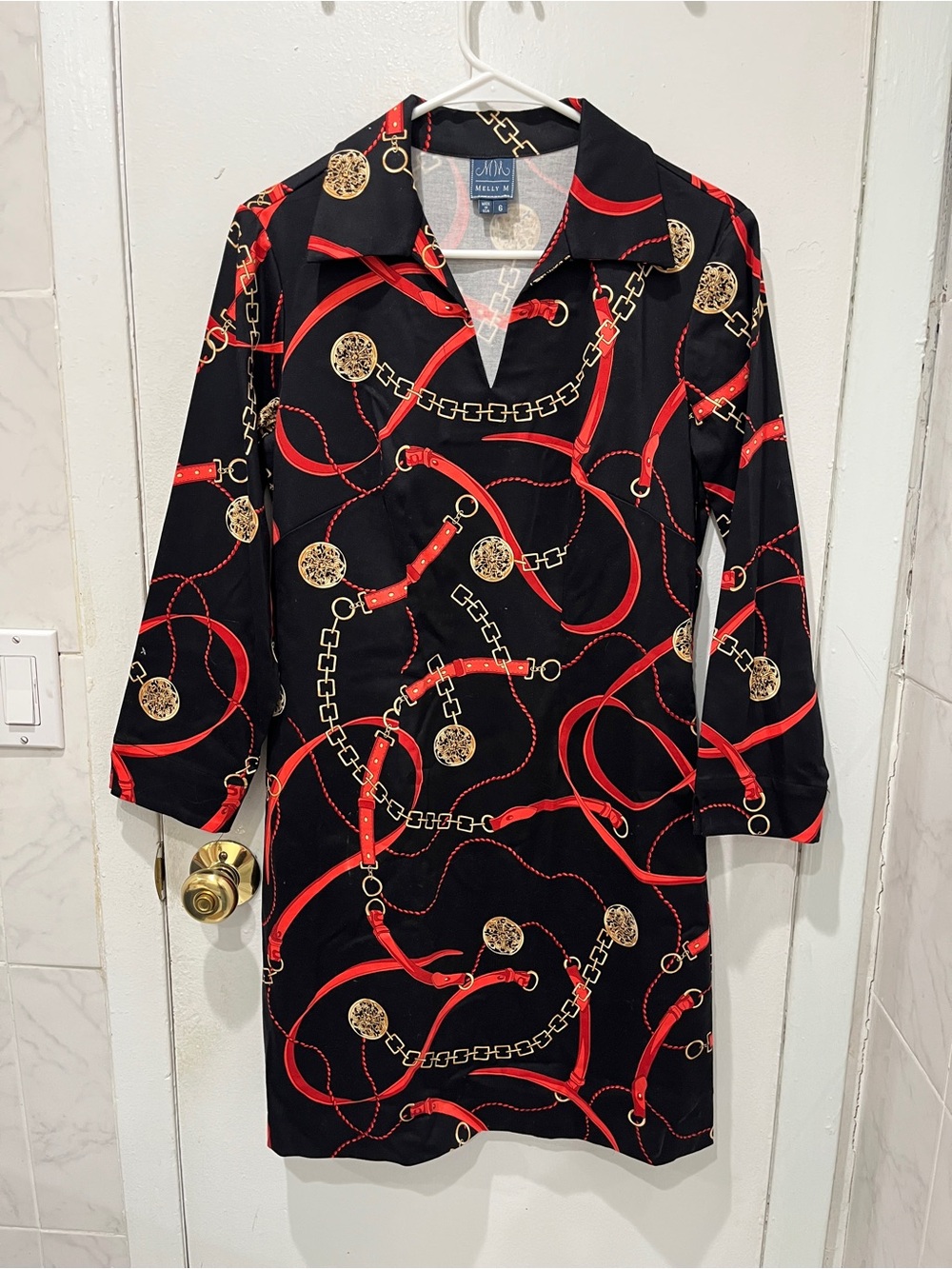 Melly M Black Dress with Red Trim & Gold Chain Motif